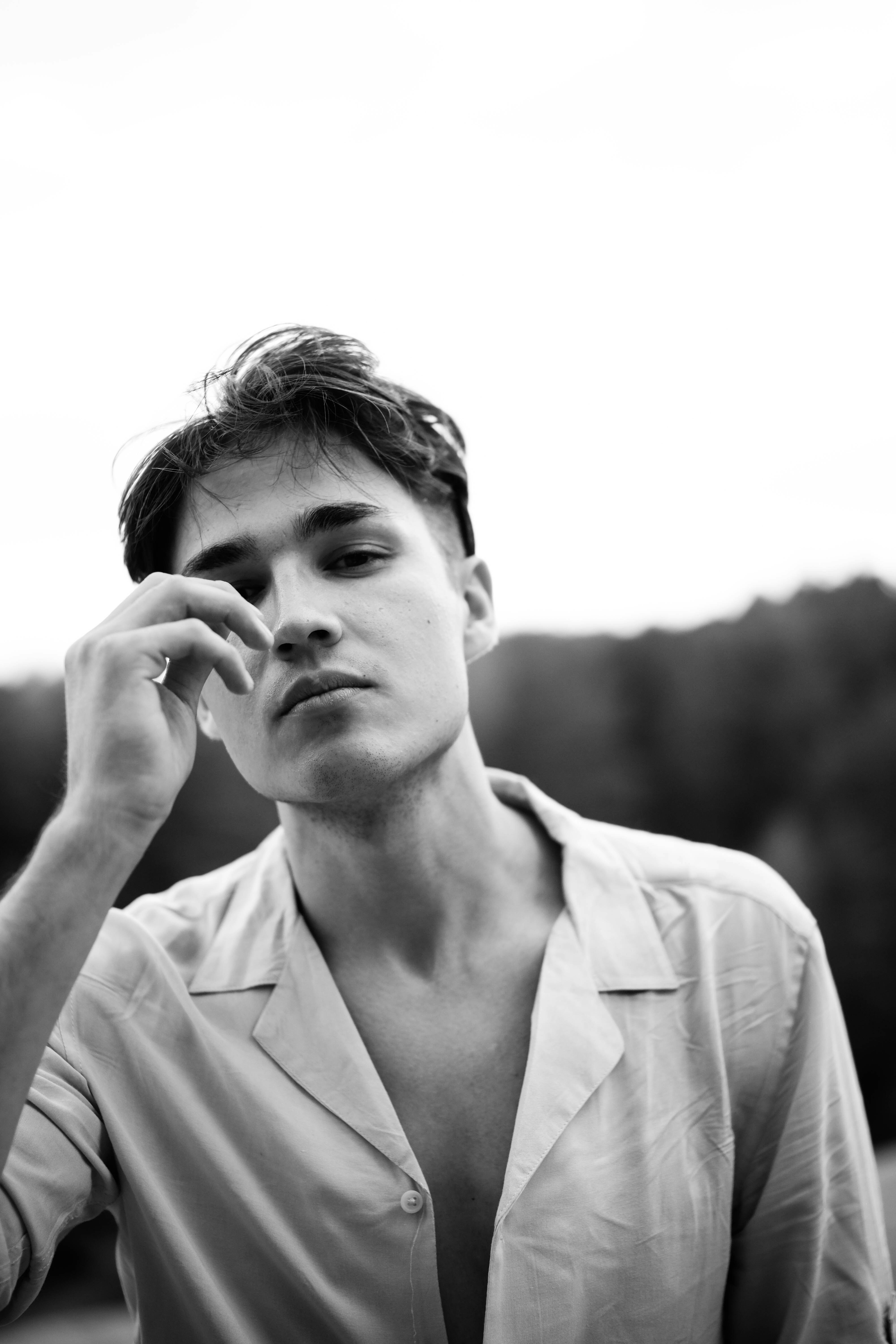 grayscale photo of man in button up shirt